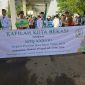 Kafilah: Sekretaris Daerah Kota Bekasi Junaedi bersama Asisten Pembangunan Kesejahteraan Masyarakat (Asda II) Kota Bekasi, Inayatullah mengawal langsung kafilah Kota Bekasi pada Pawai Ta’aruf Musabaqoh Tilawatil Qur’an (MTQ) ke-38.