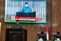 Anggota DPRD Kota Bekasi dari Fraksi PKS, Mohammad Kamil, membacakan Pandangan Akhir Fraksi PKS terhadap Laporan Hasil Pemeriksaan (LHP) BPK RI dan Laporan Pertanggungjawaban Pelaksanaan APBD (LP2APBD) Tahun Anggaran 2025 dalam Rapat Paripurna DPRD Kota Bekasi, Kamis (23/7/2026).