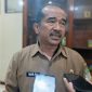 Kepala Dinas Pemberdayaan Masyarakat dan Desa (DPMD) Kabupaten Bekasi, Iman Santoso, memberikan keterangan kepada awak media usai menghadiri rapat kerja bersama Komisi I DPRD Kabupaten Bekasi di Gedung DPRD Kabupaten Bekasi, Senin (27/7/2026), terkait perkembangan tahapan Pemilihan Kepala Desa (Pilkades) Serentak 2026.