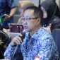 Kepala Diskominfosantik Kabupaten Bekasi, Yan Yan Akhmad Kurnia, menyampaikan paparan saat mengikuti sesi Interview Evaluasi Penyelenggaraan Statistik Sektoral (EPSS) Tahun 2026 bersama Tim Penilai Badan Pusat Statistik (BPS) Provinsi Jawa Barat secara virtual di Ruang Command Center Pemkab Bekasi, Cikarang Pusat, Kamis (9/7/2026).