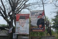 SETIAMEKAR — Suasana Pemilihan Kepala Desa (Pilkades) Setiamekar kian hangat dengan bermunculannya spanduk dan baliho dukungan dari para bakal calon. Dua figur utama yang menarik perhatian warga adalah petahana H. Suryadi, S.H. dan calon pengusung perubahan Drs. Kasan Abdullah, MM.