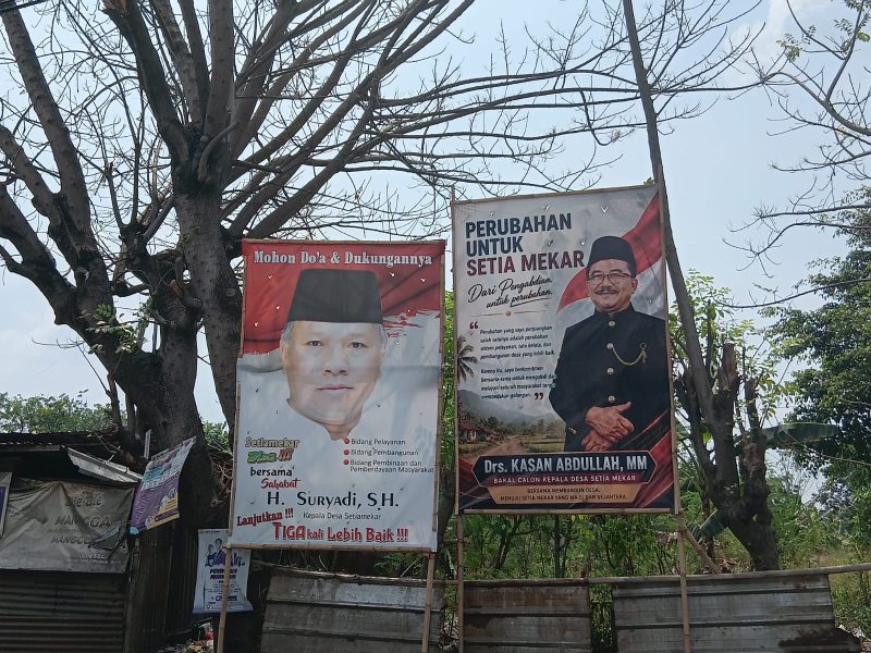 SETIAMEKAR — Suasana Pemilihan Kepala Desa (Pilkades) Setiamekar kian hangat dengan bermunculannya spanduk dan baliho dukungan dari para bakal calon. Dua figur utama yang menarik perhatian warga adalah petahana H. Suryadi, S.H. dan calon pengusung perubahan Drs. Kasan Abdullah, MM.