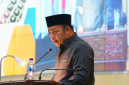 Anggota DPRD Kabupaten Bekasi sekaligus Ketua Fraksi PKB Ahmad Faisal S.H.I saat membacakan laporan pada paripurna DPRD Kab Bekasi Jum'at (31/7). Dok. Istimewa
